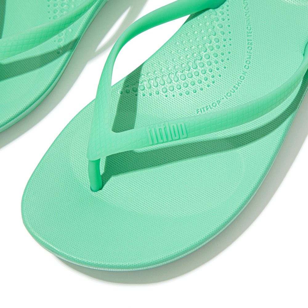 mint green nike flip flops